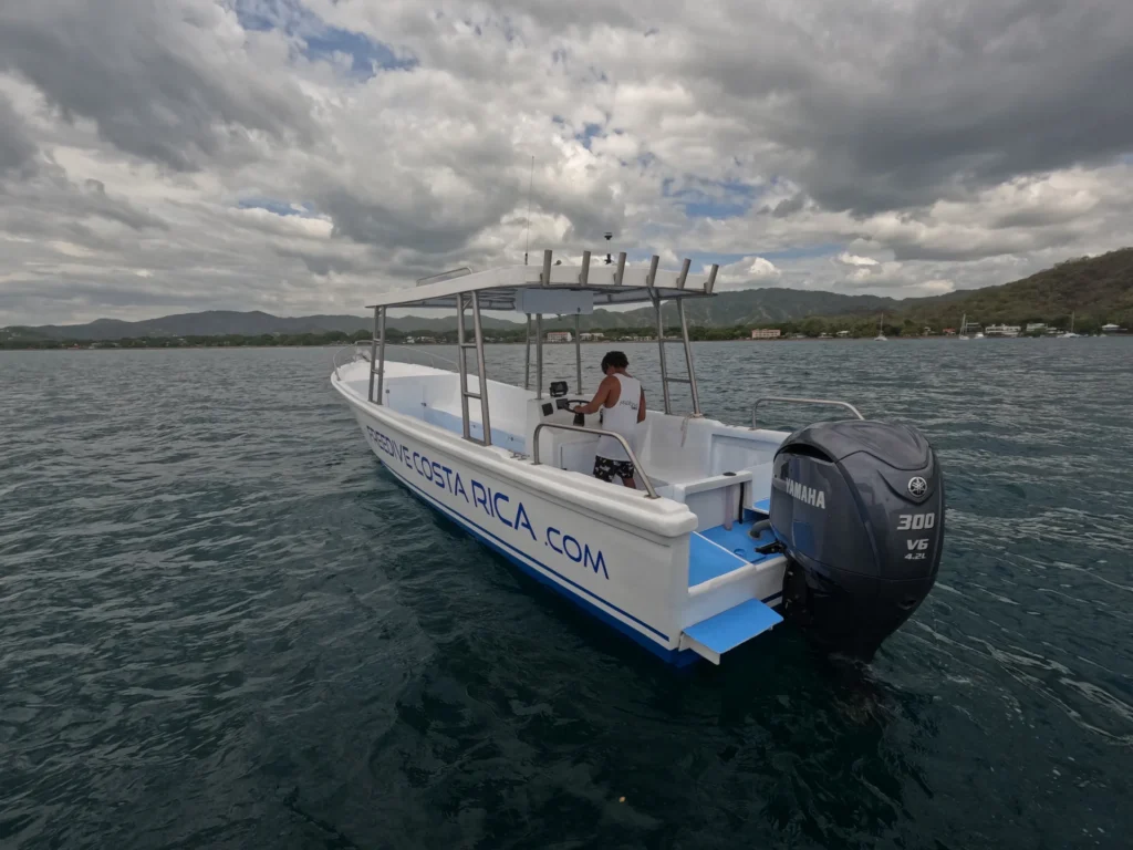 Freedive Costa Rica boat with shaded seating area and outboard motor