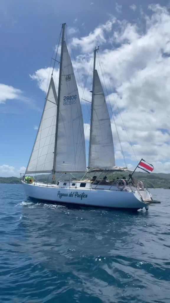 Pegasus sailing with its sails raised along the Guanacaste coast